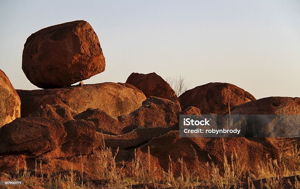 Devils Marbles (Karlu Karlu) The Devils Marbles are huge granite boulders scattered across a wide, shallow valley, 100 kilometers south of Tennant Creek in the Northern Territory.  Australia Stock Photo