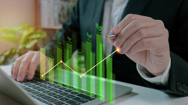 Businessman use laptop analyzing sustainability company growth with digital virtual graphics, financial data for long term investment.