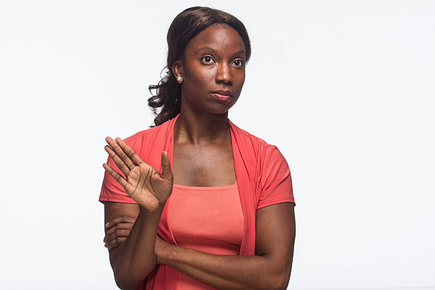 istock Woman looking annoyed and has her hand up, horizontal 187904285