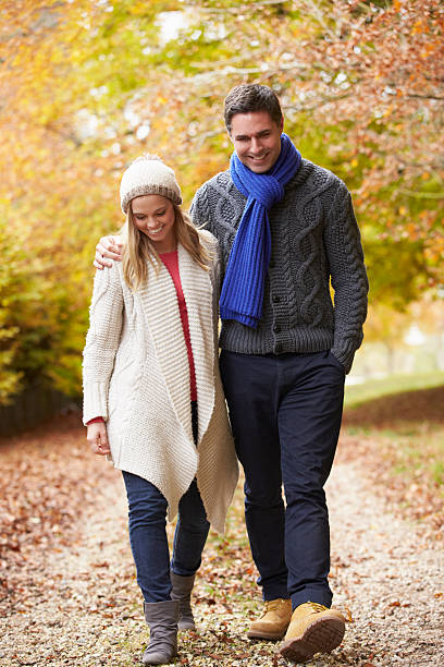 istock Couple Walking Along Autumn Path 187906677