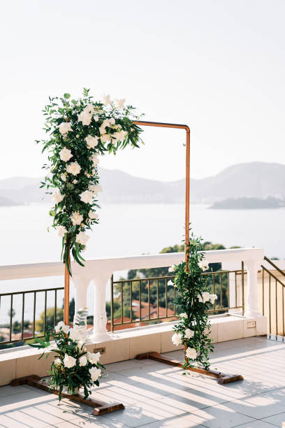 istock Rectangular wedding arch stands on a terrace above the sea against the backdrop of mountains 1879072016