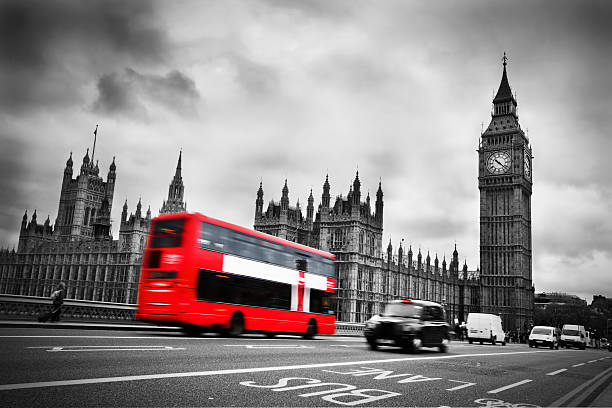 istock Red double decker bus heading towards Big Ben in London 187907291