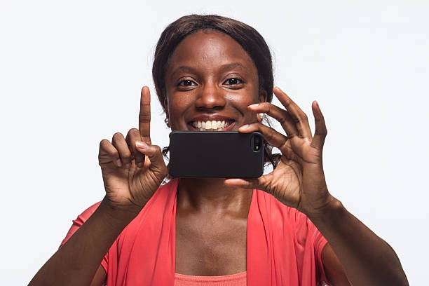 istock Woman taking picture with phone, horizontal 187907432