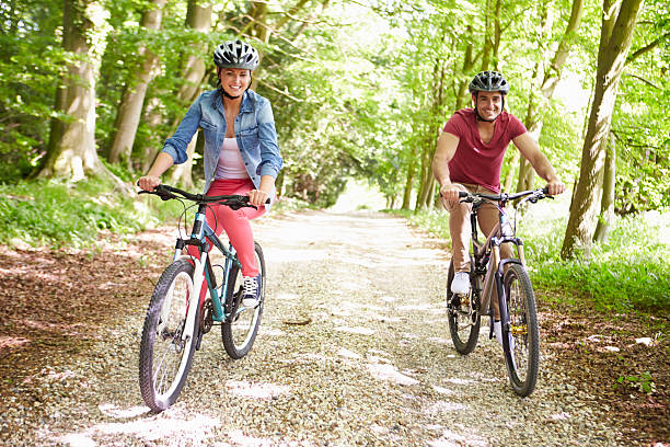 istock Young Couple On Cycle Ride In Countryside 187907858