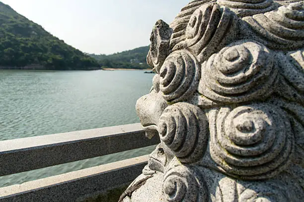 Chinese Lion Looking over the water, Lamma Island Hong Kong