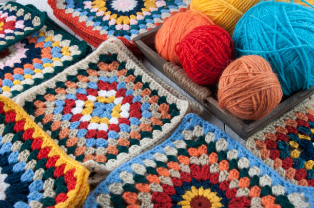 istock Colored knitting threads  in a wooden box 1879098888
