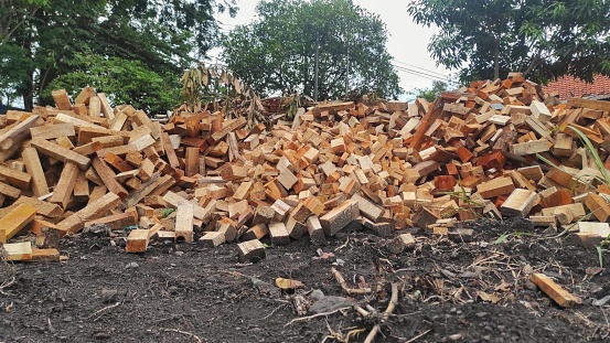A pile of waste of the wood industry in urban which still can use to be recycled