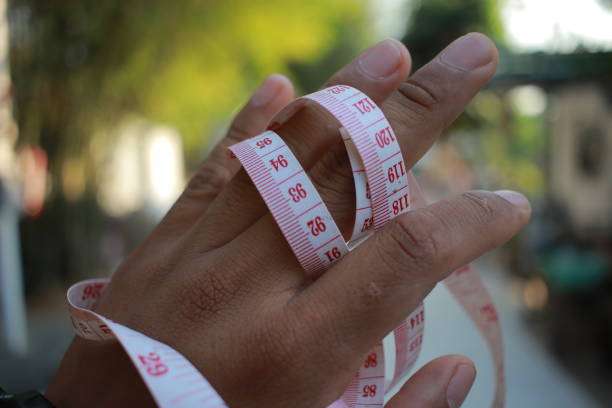 istock measuring tape in hand 1879125588