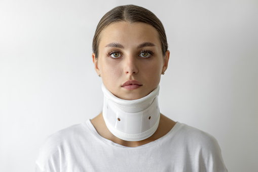 Woman wearing a neck brace