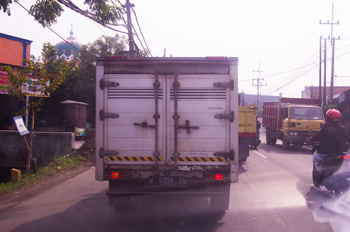 Gresik, Indonesia, 04 January 2023 - rear view of a box truck carrying goods in Indonesia