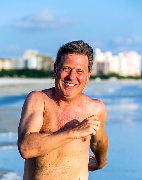 istock man enjoys jogging along the beach 187915918