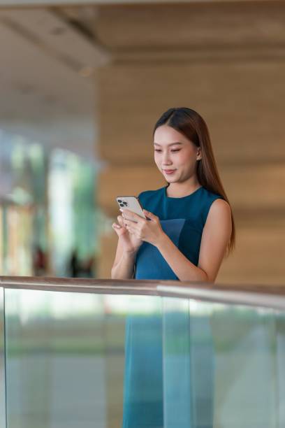 istock Asian Business Woman Using Smartphone. 1879164283