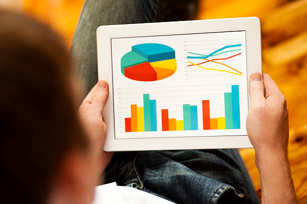 istock Looking at stock market charts or graphs on a digital tablet 187916713