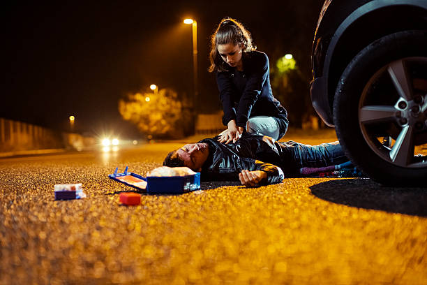istock Car accident with CPR procedure for the injured victim 187916894