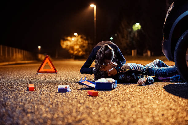 istock Car accident with CPR procedure for the injured victim 187916910