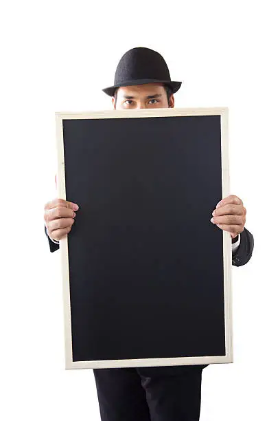 Businessman holding a blackboard in hands.