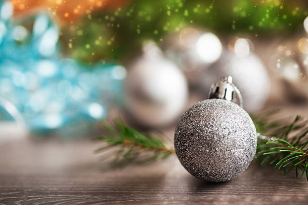 istock Close up of silver christmas decoration on old plank 187918501