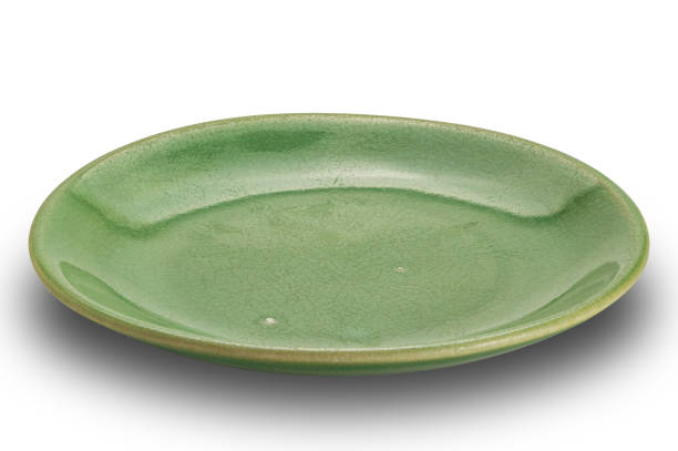 istock High angle view of empty green shallow ceramic plate. 1879195824