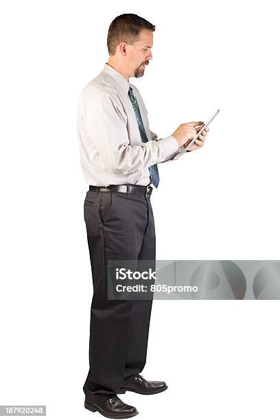 Corporate Man Standing While Using Tablet Stock Photo - Download Image Now - Button Down Shirt, Color Image, Computer