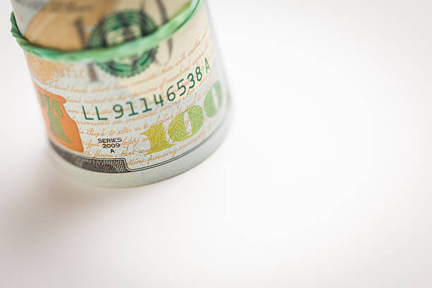 istock Abstract Roll of Newly Designed One Hundred Dollar Bills 187921161