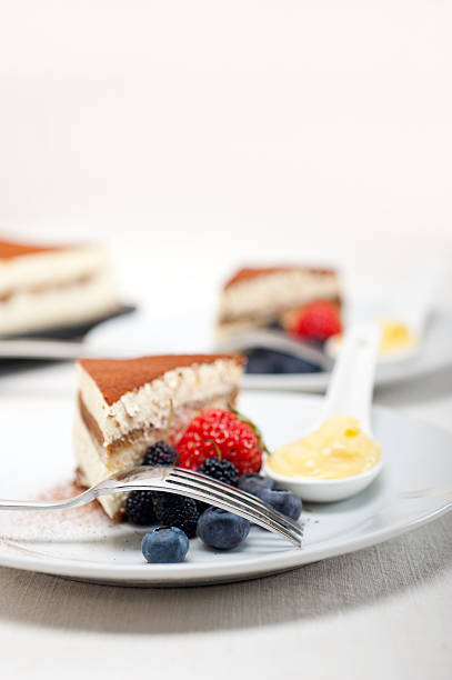 istock tiramisu dessert with berries and cream 187921545