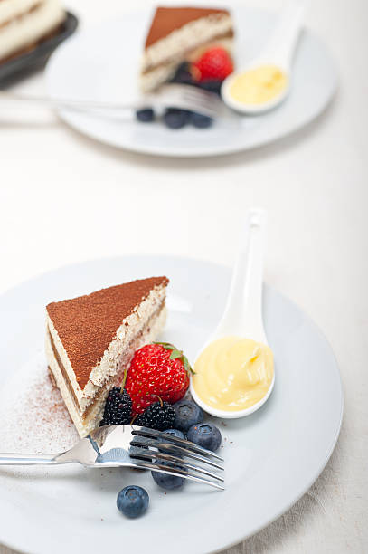 istock tiramisu dessert with berries and cream 187921546
