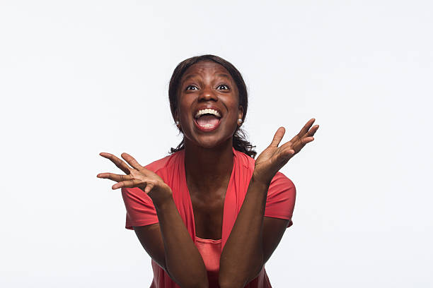 istock African-American woman excited, looking up 187922228