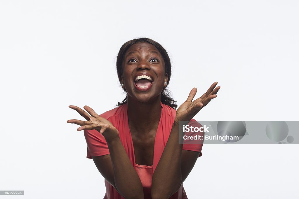 African-American woman excited, looking up Black woman happy and ecstatic, smiling, horizontal Achievement Stock Photo