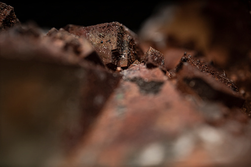 Abstract rough alien surface. Ferrous iron ore rock close up.