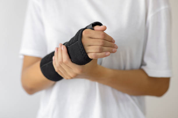 istock Woman with a broken arm wearing an arm splint 1879232130