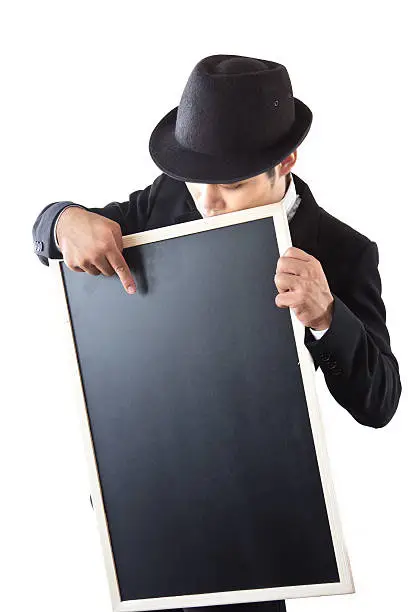 Businessman holding a blackboard in hands.