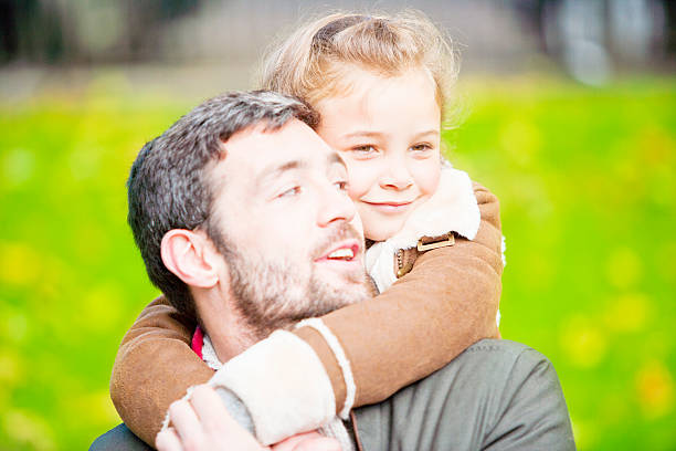 istock Father and daughter in a London`s park 187924690