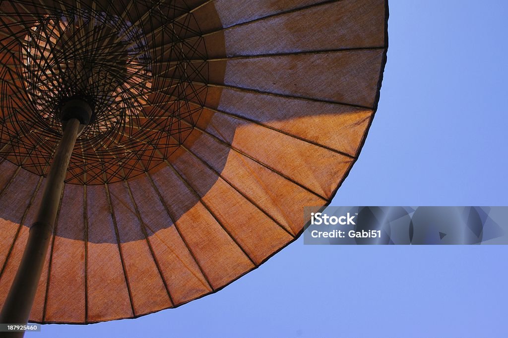 decoration umbrella blue sky red body Arid Climate Stock Photo