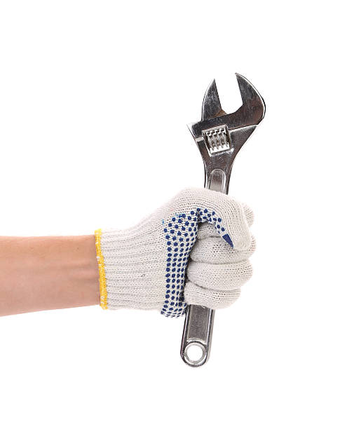 istock Wrench in red gloves. 187925619
