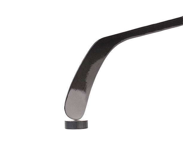 istock Black ice hockey stick and puck. 187925670