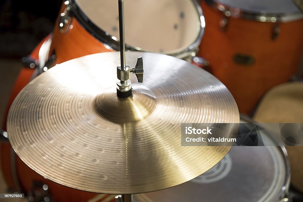 shiny hi-hat cymbals on stand with wooden orange drum-kit golden-yellow hi-hat cymbals on stand against orange drum-kit background Snare Drum Stock Photo