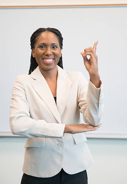 African woman signing the word "day" Woman of African descent signing DAY american sign language photos stock pictures, royalty-free photos & images