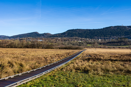 Marais de Vaux, and its wooden path, on the Plateau d’Hauteville in winter