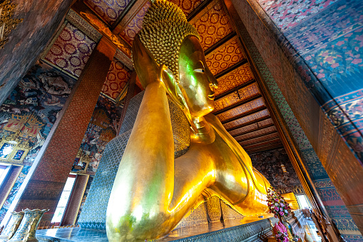 gold Buddha statue in the Wat Pho temple in Bangkok Thailand