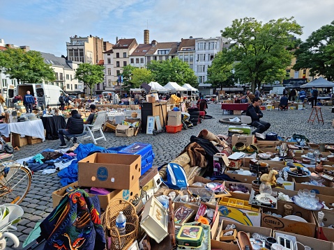 Brussels Flea Market. The image shows a city square with a flea market, captured during autumn season.