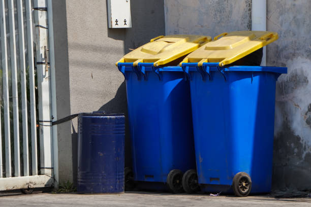 istock Big blue plastic trash can for home or office use. Garbage sorting bins recyclable and other waste in Yogyakarta, Indonesia. Separate waste collection bins in the airport, pedestrian walk or parks. 1879378934