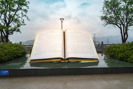 Yichang, Hubei Province, China - March 18, 2018: A large open book monument stands majestically in the Tanziling Scenic Area along the Yangtze River.