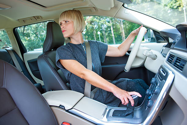 woman driver parking her car stock photo