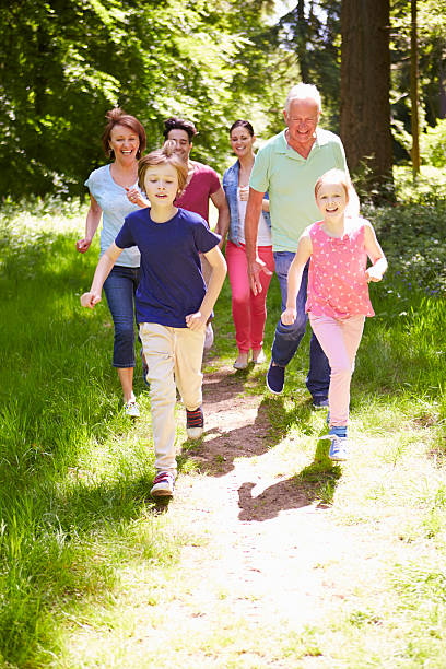 istock Multi Generation Family Running Through Summer Countryside 187940913