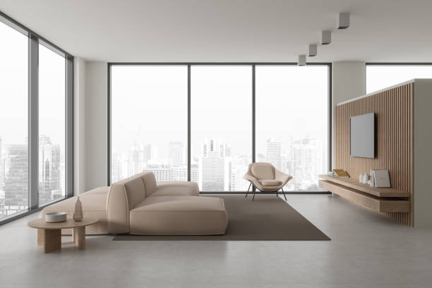 istock Cozy home living room interior with couch and tv display with panoramic window 1879426594