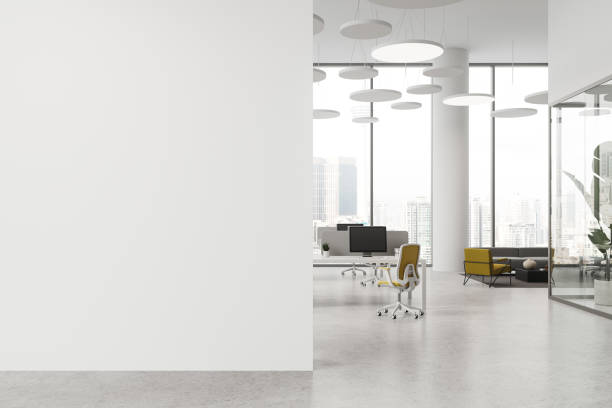 istock White office interior with pc computer and furniture, window. Mock up wall 1879431656