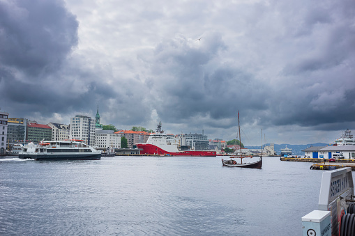 Bergen, Norway, June 29, 2023: The Bergen Port, pictured here in summer,  is an international seaport shared by commerical and recreational boats and is conists of  two bays, Vagen and Puddefjorden.