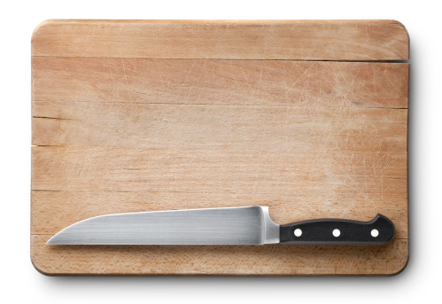 Wooden cutting board with kitchen knife. Photo with clipping path.