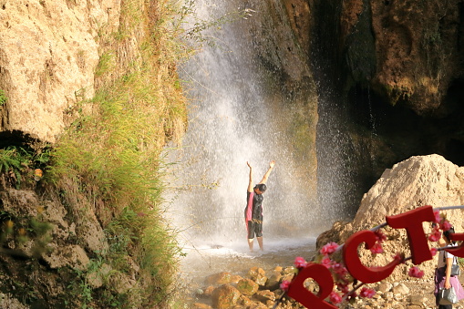 August 21 2023 - Arslanbob, Kyrgyzstan in Central Asia: People at the so-called 'small waterfall' at the top of Arslanbob village, near Jalal-Abad in southern Kyrgyzstan