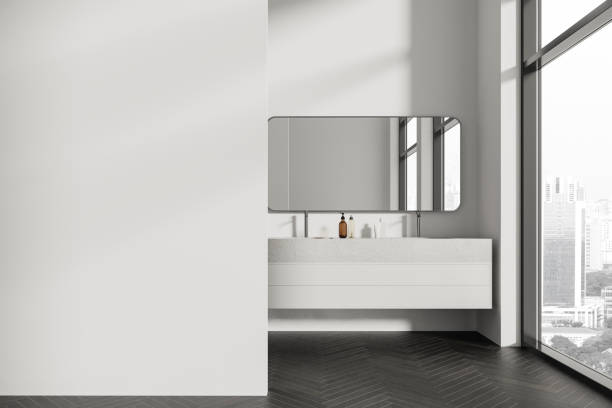 istock White hotel modern bathroom interior with double sink and window, mock up wall 1879503313